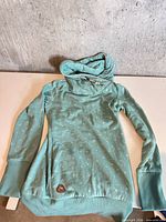 Full view of teal Ragwear hoodie front