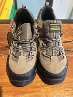 Front view of pair showing brand tag and lacing