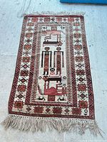 Full view of rug showing overall design and fringe