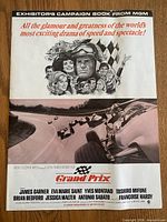 Front cover of campaign book showing Grand Prix artwork and MGM header