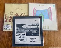 Front view of all three Genesis records in sleeves