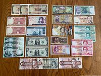 All 20 notes laid out in four rows showing both sides facing up for identification