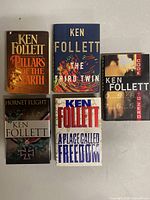 Group shot of all five Ken Follett hardcovers