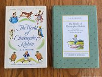 Both editions of The World of Christopher Robin side by side showing covers