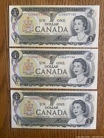Obverse of all three sequential $1 notes