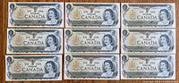 Full view of all nine sequential 1973 $1 notes