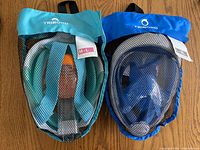 Both masks in mesh bags showing size tags M-L and L-XL