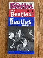 Stacked view of the three Beatles Monthly Book magazines showing covers and issue numbers