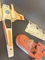 Top view of X-Wing, partial Landspeeder, instruction sheet visible