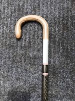 Close-up of cow horn hook handle and upper aluminum collar