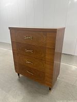 Front and right side view showing four drawers, handles, legs