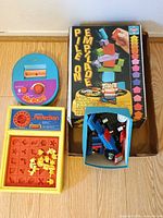 Overview of Perfection, Mr. Pop, Pile On box and Lego parts