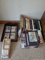 Group view of books, photo tray, calendar, game, puzzle