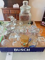 Overall lot showing beverage dispenser and glassware in trays