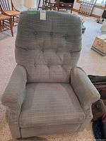 Front view of La-Z-Boy recliner showing seat, arms, tufted back