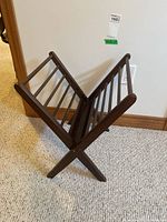 Full view of wooden folding magazine rack standing open