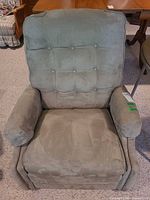 Front view of pale green suede manual rocking recliner