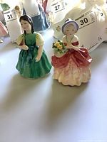 Front view of both figurines Francine and Cissie