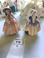 Both figurines standing together