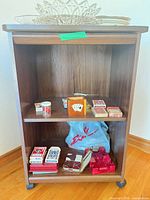 front view of shelf showing card decks and dice