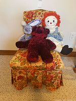 Chair front view with three plush toys