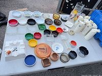 Top view of entire lot displaying ashtrays, dishes, pitcher and glasses