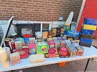 Tabletop view showing full assortment of decorative tins