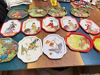 All 14 trays laid out showing variety of designs