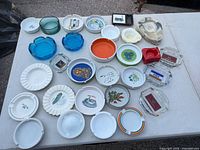 Overview of all ashtrays on table showing quantity, materials and variety