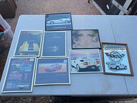 Group shot of all eight framed prints on table