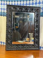 Full view of carved wood mirror front