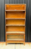 Full view of assembled stacking barrister bookcase showing five sections and footed base
