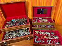 overall lot showing two wooden boxes filled with jewelry