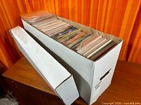 Long white comic long box filled with comics plus lid