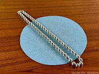 Full view of bead necklace laid flat