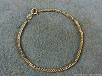 Full view of sterling silver chain bracelet in circular layout