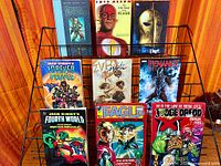 Full view of nine books on display rack