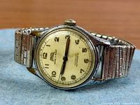 Front view of Egona wristwatch showing dial, hands, bracelet