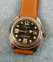 Front view of Ingraham wristwatch showing dial details and leather strap