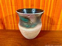 Full view of vase showing geometric glazed band and matte lower body