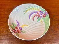 Top view of bowl showing full floral design and molded swirl background