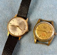 Front view of both wristwatches showing dials and cases