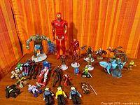 Full group shot of all action figures and accessories on tabletop
