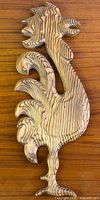 front view of carved wood rooster wall hanging