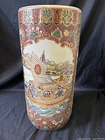 Full view of cylindrical vase with boat scene and moriage border