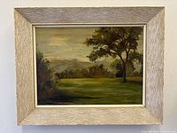 Front view of framed landscape painting