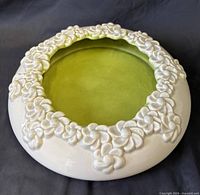 Top view showing full bowl, raised daisy rim, green interior