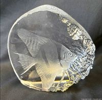 Front view of clear glass sculpture showing etched angelfish design