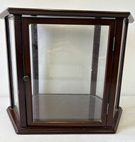 Front angled view showing overall form and glass door