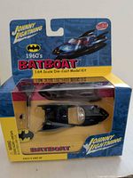 Front view of sealed Johnny Lightning 1960s Batboat kit packaging
